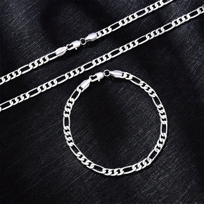 Elegante e versatile set di collana e bracciale Fegaro in argento 925, adatto sia a uomini che a donne, con bassa allergenicità. Perfetto per abbigliamento casual, hip-hop, punk, sport, feste e come regalo per le vacanze. Confezionato in un'adorabile conf