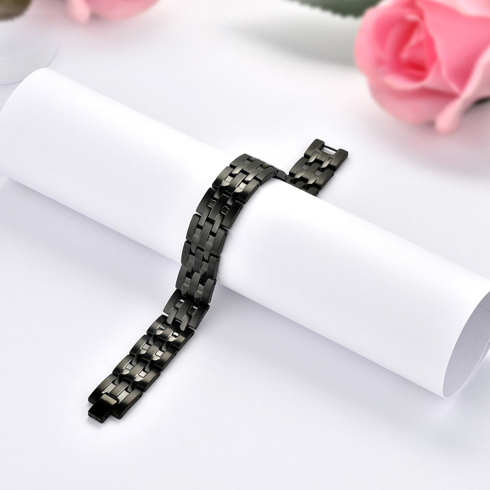 Bracciale Magnetico Uomo JewelryWe con Calamite - Fascia Regolabile in Acciaio Inossidabile (4 Colori: Nero, Bianco, Grigio, Oro) & Ideale per Tutto l'Anno a Parti di Eventi e Motociclette