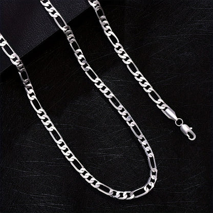 Elegante e versatile set di collana e bracciale Fegaro in argento 925, adatto sia a uomini che a donne, con bassa allergenicità. Perfetto per abbigliamento casual, hip-hop, punk, sport, feste e come regalo per le vacanze. Confezionato in un'adorabile conf