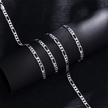 Elegante e versatile set di collana e bracciale Fegaro in argento 925, adatto sia a uomini che a donne, con bassa allergenicità. Perfetto per abbigliamento casual, hip-hop, punk, sport, feste e come regalo per le vacanze. Confezionato in un'adorabile conf